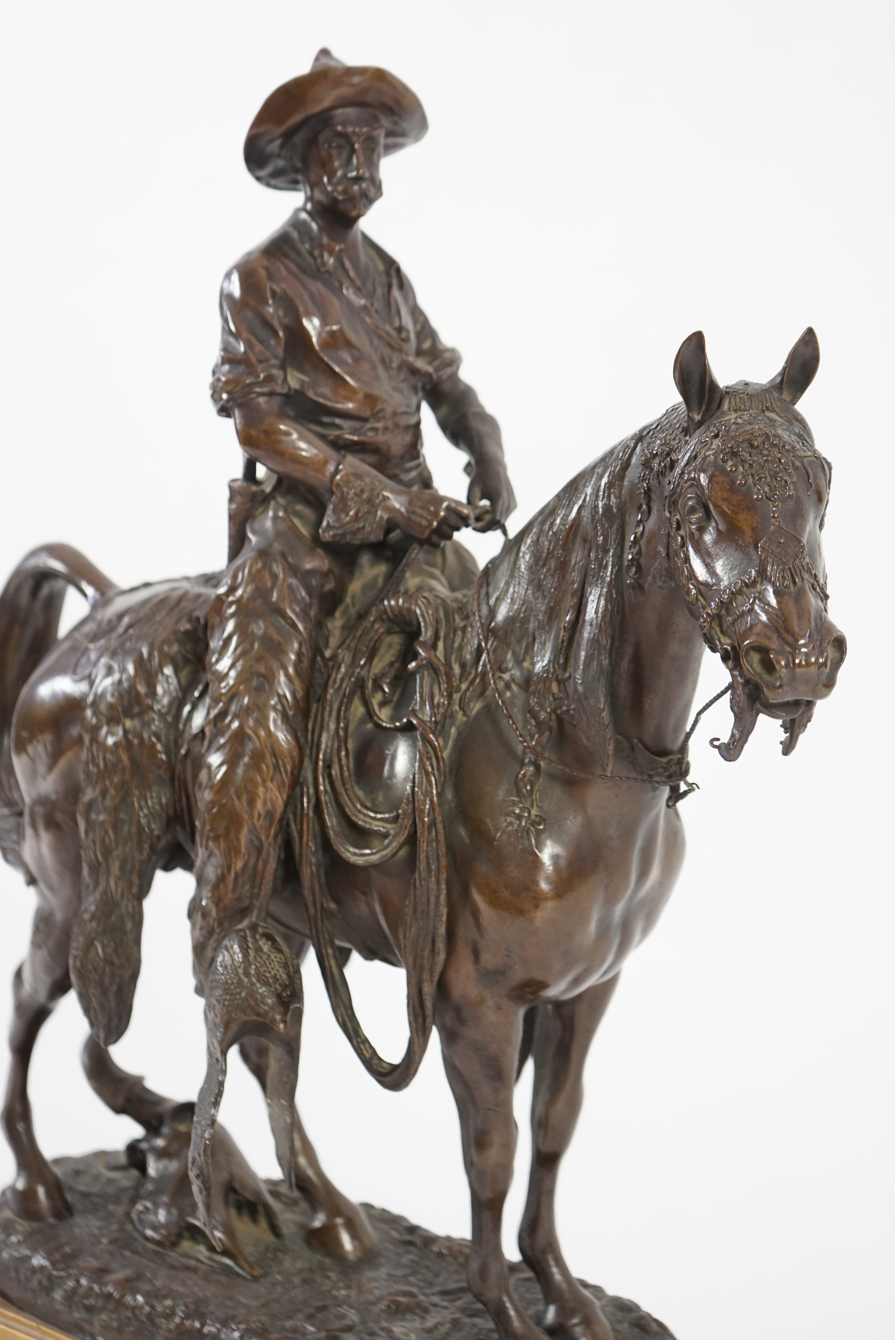Walter Winans (St. Petersburg, 1852-Parsloe Park, Essex, 1920), a cast bronze of the artist, as a cowboy, riding the Arab stallion Skowronek, 50cm wide, 66cm high, overall 79.5cm high